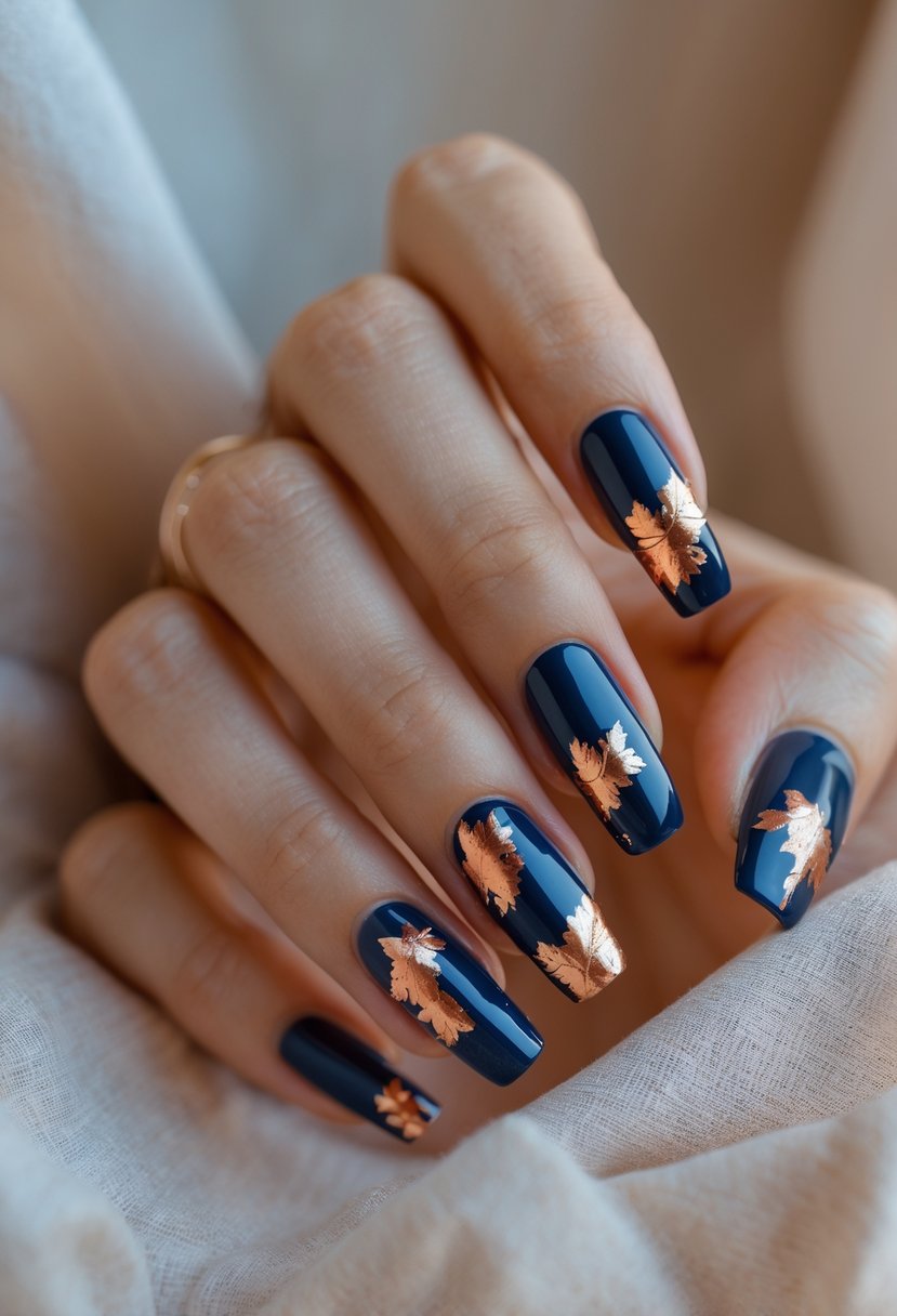 Close-up of hands with navy blue nails featuring copper foil accents.